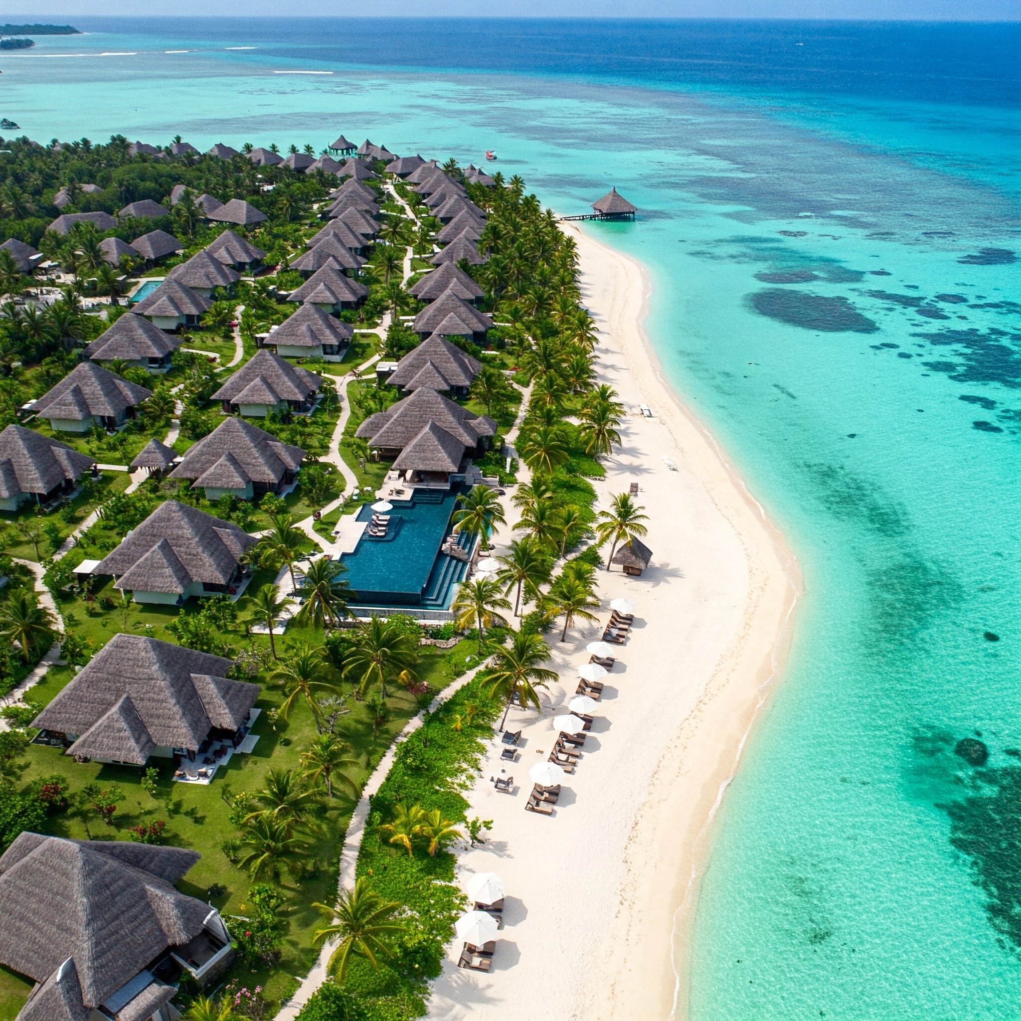 Worker performing painting on industrial equipment
